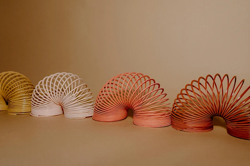 Plastic colorful springs illustrating iterative workflows
