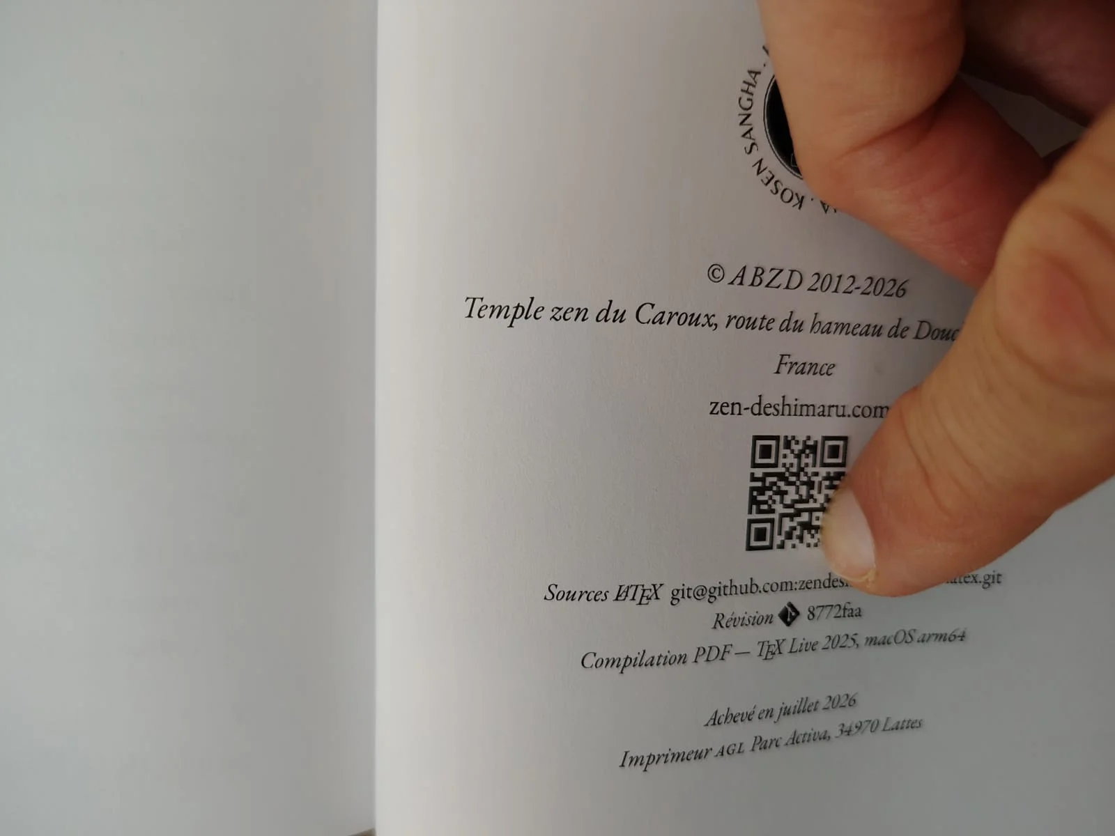 Colophon of the printed book showing the Git commit hash 8772faa and TeX Live 2025 compilation metadata on macOS arm64