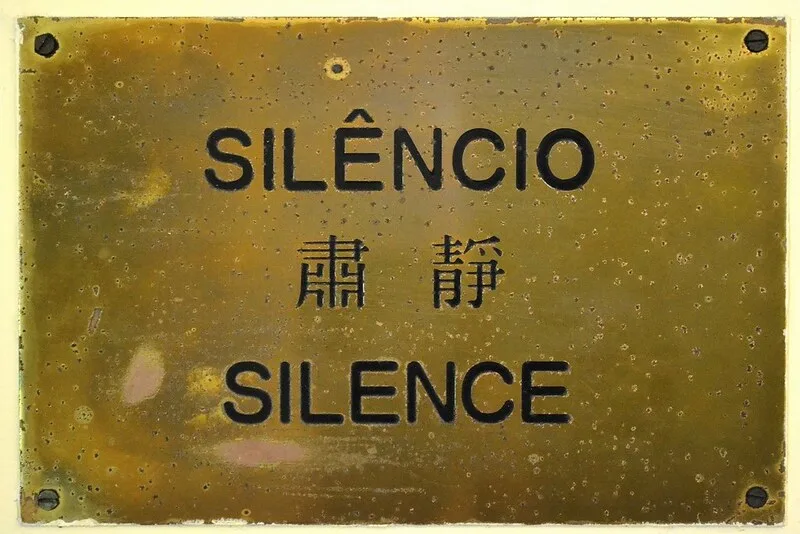 A sign giving the same message in three languages