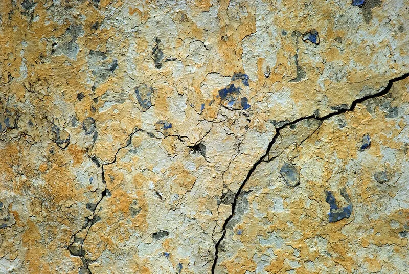 A barely visible hairline crack running through a wall